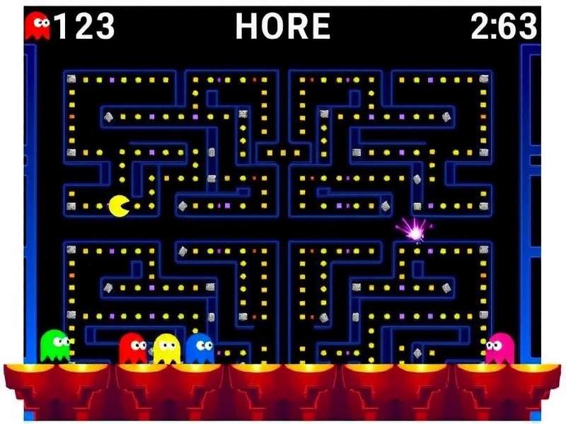 Classic Pac-Man arcade cabinet in a dimly lit arcade setting